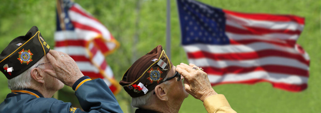Veterans giving respect on the USA flag
